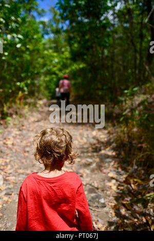 Mother and daughters walk along the Dalrymple gap walking track, QLD, Australia Stock Photo