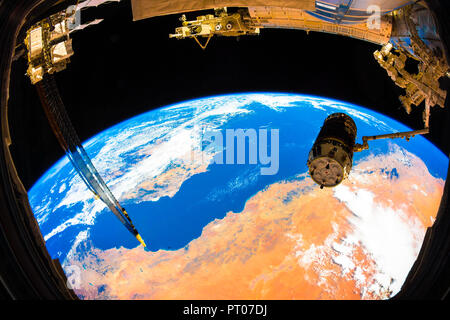 The JAXA's (Japan Aerospace Exploration Agency) H-II Transfer Vehicle-5 or 'Kounotori' in the grips of the International Space Station's Canadarm2 rob Stock Photo