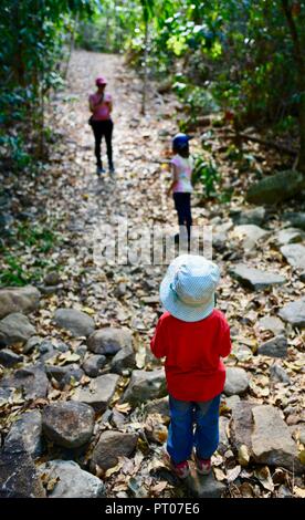 Mother and daughters walk along the Dalrymple gap walking track, QLD, Australia Stock Photo