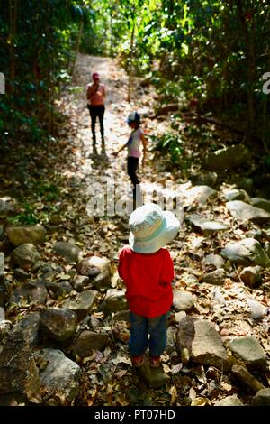 Mother and daughters walk along the Dalrymple gap walking track, QLD, Australia Stock Photo