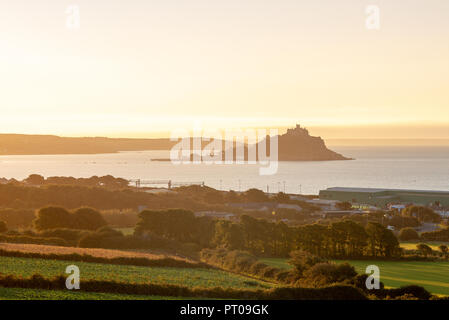 St Michael's Mount sits within Mount's Bay on the south coast of Cornwall, adjacent to the town of Marazion. Stock Photo