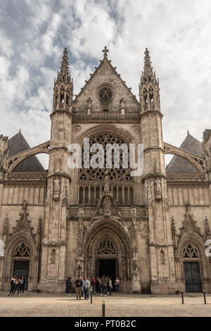 Dunkerque, France - September 16, 2018: Main entrance and facade of Saint Eloi Church in Dunkirk under white cloudy sky. People in front. Stock Photo