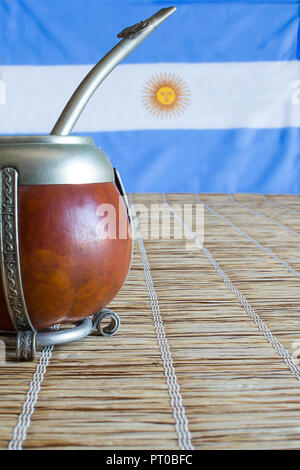 Premium Photo  Yerba mate tea and argentina flag on wooden table with copy  space. traditional argentinian beverage