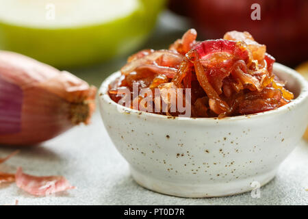 Red onion marmalade (jam, confiture, chutney) with green Apple. Delicious sauce. Gourmet. Selective focus Stock Photo