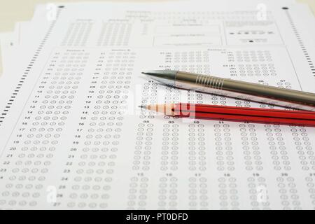 Picture of multiple omr sheet, pencil and pen. Isolated on white background. Stock Photo