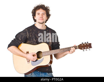 Young guy playing on a gitare and posing to camera Stock Photo