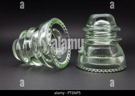 two glass telephone line insulators Stock Photo