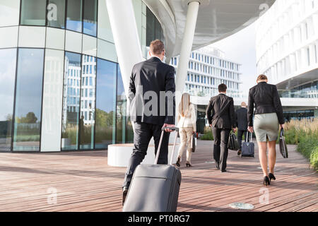 Poland, Warzawa, group of businessmen arriving at hotel Stock Photo