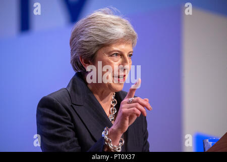 Prime Minister, Theresa May, gives her keynote speech at the Conservative Party Conference in Birmingham. She danced on to 'Dancing Queen' by ABBA. Stock Photo