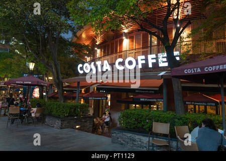 4 October 2018, Wuhan China : Costa coffee shop with name and terrace at night in Wuhan Tiandi China Stock Photo