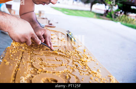 monk carving candle for candle festival in thailand Stock Photo