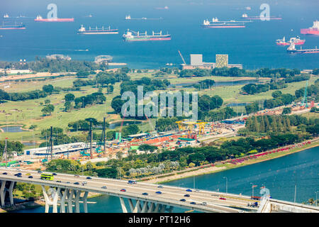 Singapore - August 18 2018: Aerial bird's eye view of Marina East Singapore featuring East Coast Expressway, Gardens by the Bay East, sea and ships Stock Photo