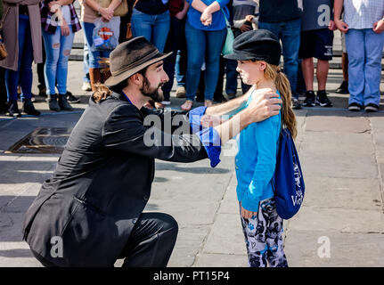 A magician performs magic tricks for tourists in Jackson Square, Nov. 11, 2015, in New Orleans, Louisiana. (Photo by Carmen K. Sisson/Cloudybright) Stock Photo