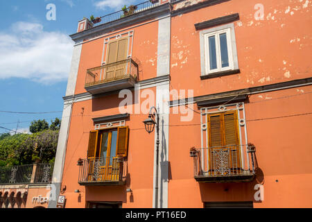 Italian buildings, wooden shutters, balcony, balconies, verandah, old fashioned, vintage concept, travel tourism, holiday, travelling ornate iron Stock Photo