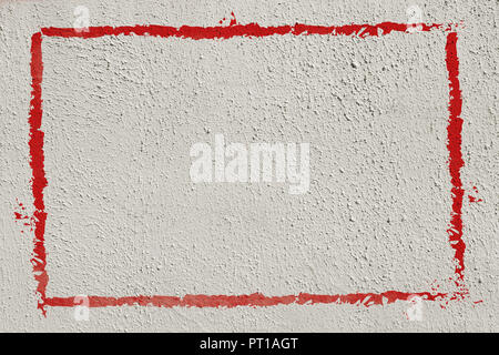 Thick red graffiti painted frame border on whitewashed concrete wall with copy space for writing Stock Photo