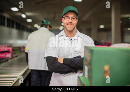 Workers in apple factory Stock Photo