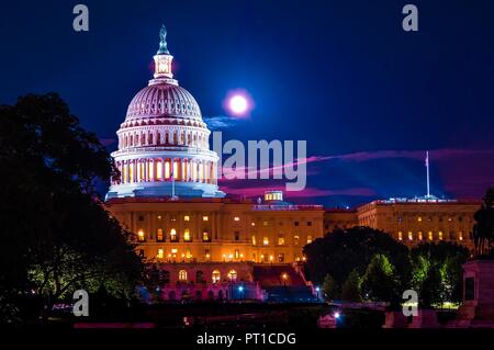 Time exposure of front entrance of United States Capital Building in Washington DC at night with full moon and clouds in background Stock Photo