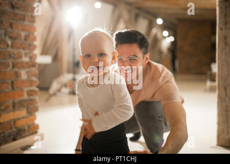 Happy father with his baby girl at home Stock Photo