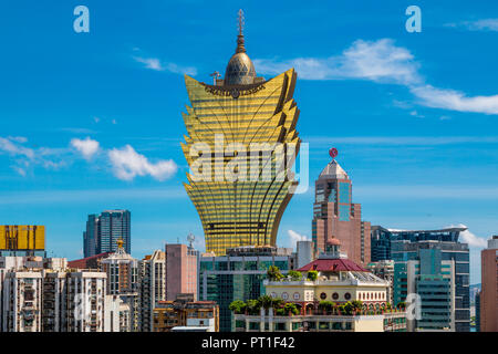 Macau, China - JULY 11, 2014: Great view of the cityscape of Macau including the casino Grand Lisboa with its golden windows, taken on Macau's Mount... Stock Photo