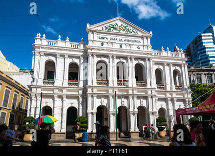 Macau, China - JULY 11, 2014: The facade of the Holy House of Mercy of Macau, a Neoclassical-style building in Senado Square, right in the city centre... Stock Photo