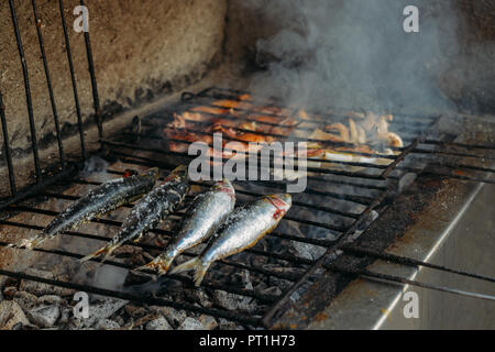 Grilled salty mackerel fish on the grill closeup, captured in Portugal Stock Photo