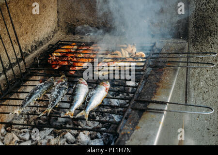 Grilled salty mackerel fish on the grill closeup, captured in Portugal Stock Photo