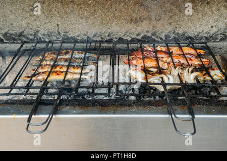Grilled salty mackerel fish on the grill closeup, captured in Portugal Stock Photo
