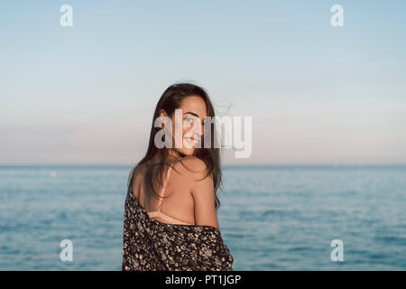 Beautiful woman on the beach, smiling, portrait Stock Photo