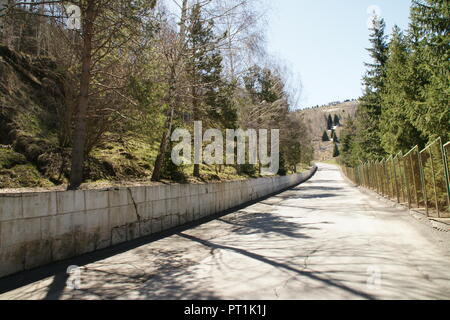 Almaty city street to medeo with no cars in the early morning on Sunday, travel to business Stock Photo