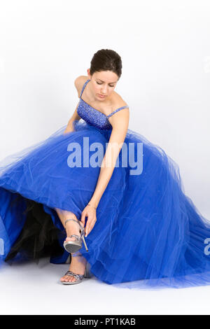 Beautiful young lady in blue prom dress Stock Photo