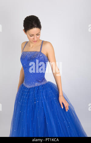 Beautiful young lady in blue prom dress Stock Photo