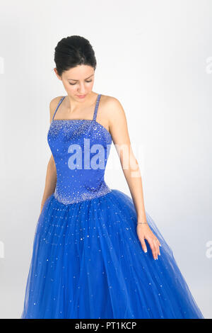 Beautiful young lady in blue prom dress Stock Photo