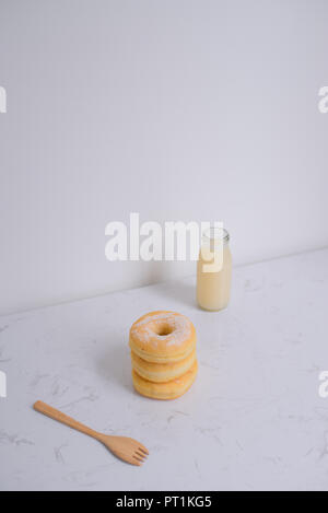 Classic donut. Morning breakfast on table in living room at home. Stock Photo
