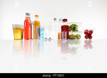 Various plastic packagings, beer, juice, cups Stock Photo