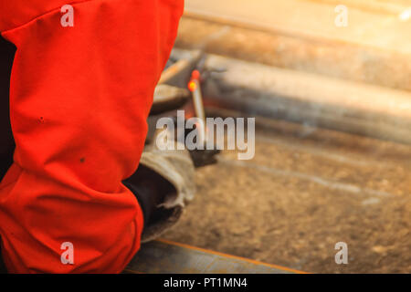 Abstract blurred focus with bokeh of steel welding with sparks. Blurry of welding for industrial concept. Stock Photo