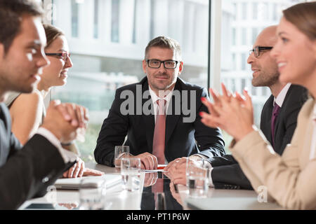 Poland, Warzawa, meeting of five businessmen at conference room Stock Photo