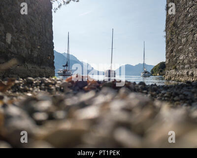 Sailboats in the calm water of Lake Como, Pescallo, Bellagio, Province of Como, Lombardy, Italy Stock Photo