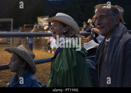 Colorado, USA. 22nd Aug, 2018. Rodeo spectators look on at the Snowmass Rodeo on August 22, 2018 in Snowmass, Colorado. Credit: Alex Edelman/ZUMA Wire/Alamy Live News Stock Photo