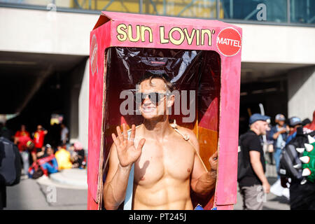 New Yoek, USA. 5 October 2018.  Cosplayer arrives wrapped in 'Ken' box during Comic Con at Javits Convention Center in New York. Credit: William Volcov/ZUMA Wire/Alamy Live News Stock Photo