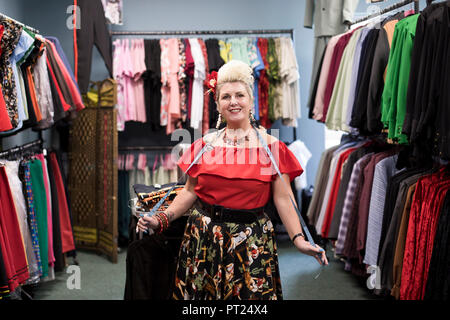 Norfolk, UK. 5 October 2018.  Beth Dunne and her 'Flamin Star' fashion stall at the Hemsby Rock 'n' Roll Weekender in Norfolk, England. Rock 'n' roller Beth from Bognor Regis has been trading at Hemsby festival for 8 years, orginally coming just as a Weekender. Flamin Star that specialises in 50s style clothing now trades at events all around Europe. Credit: Adrian Buck/Alamy Live News Stock Photo