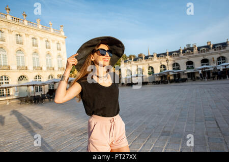 Young woman tourist having fun on the central square traveling in Nancy city in France Stock Photo