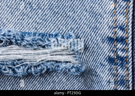 Denim Texture Of Torn Up Jeans Stock Photo