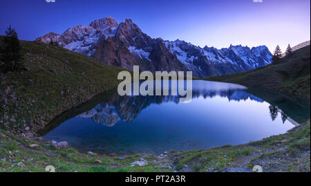 Mont Blanc mountain range is reflected in Lac Checrouit during dusk, Checrouit Lake, Veny Valley, Courmayeur, Aosta Valley, Italy, Europe Stock Photo