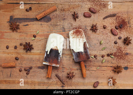 Homemade coffee and white chocolate ice lollies with winter spices, decoration Stock Photo