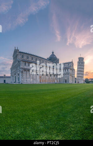 Italy, Tuscany, Pisa, View to Pisa Cathedral and Leaning Tower of Pisa from Piazza dei Miracoli at sunset Stock Photo