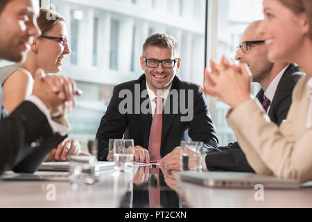 Poland, Warzawa, meeting of five businessmen at conference room Stock Photo