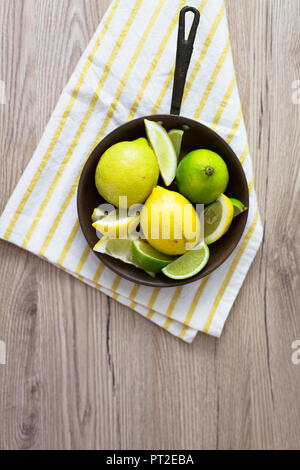 Fresh lemon in pan, overhead view Stock Photo