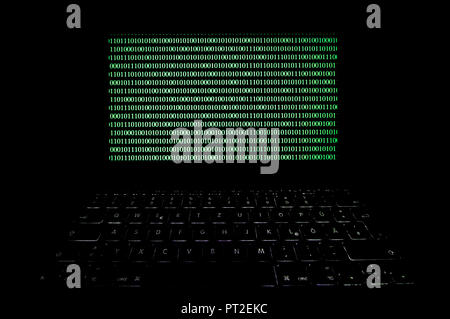 Laptop with binary code, cybercrime Symbolical image, privacy Stock Photo