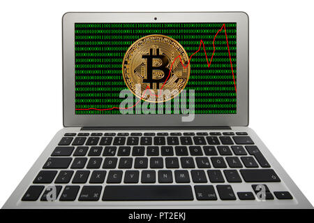 Symbol image of turbulence, volatility, stock price digital currency, golden physical coin Bitcoin laptop with digital binary code Stock Photo