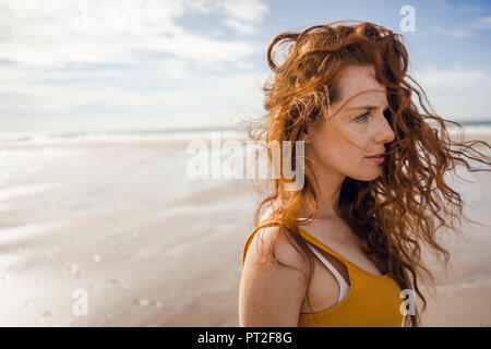 Portrait of a redheaded woman on the beach Stock Photo